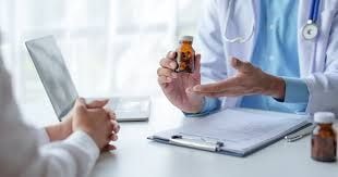 Healthcare professional discussing medication with patient